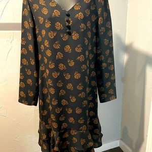 Chai’s dress. Black and brown.